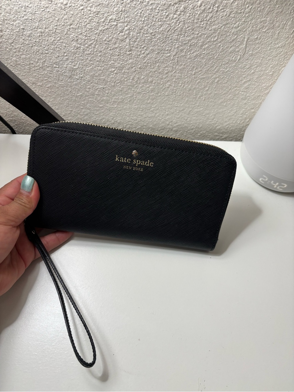 kate spade black zip-around wristlet clutch with gold logo